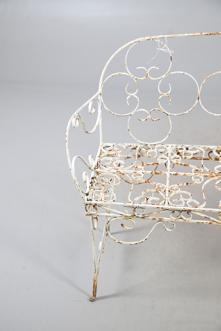 WROUGHT IRON GARDEN BENCH AND TABLE.