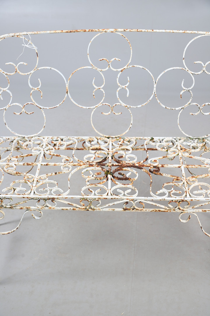 WROUGHT IRON GARDEN BENCH AND TABLE.