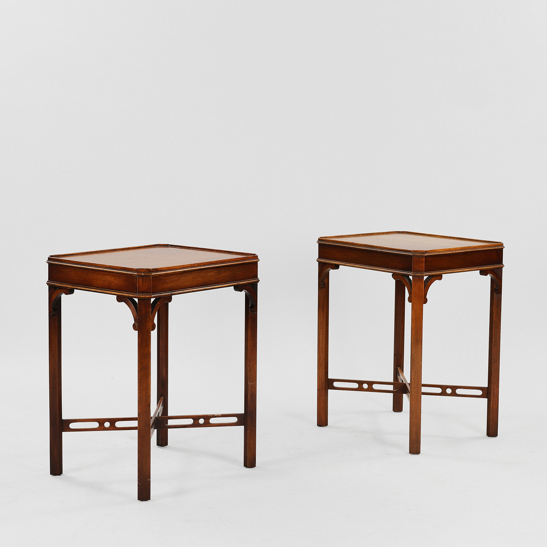 REPRODUX: A pair of mahogany side/lamp tables in Chippendale style, England, 1970s, (2).