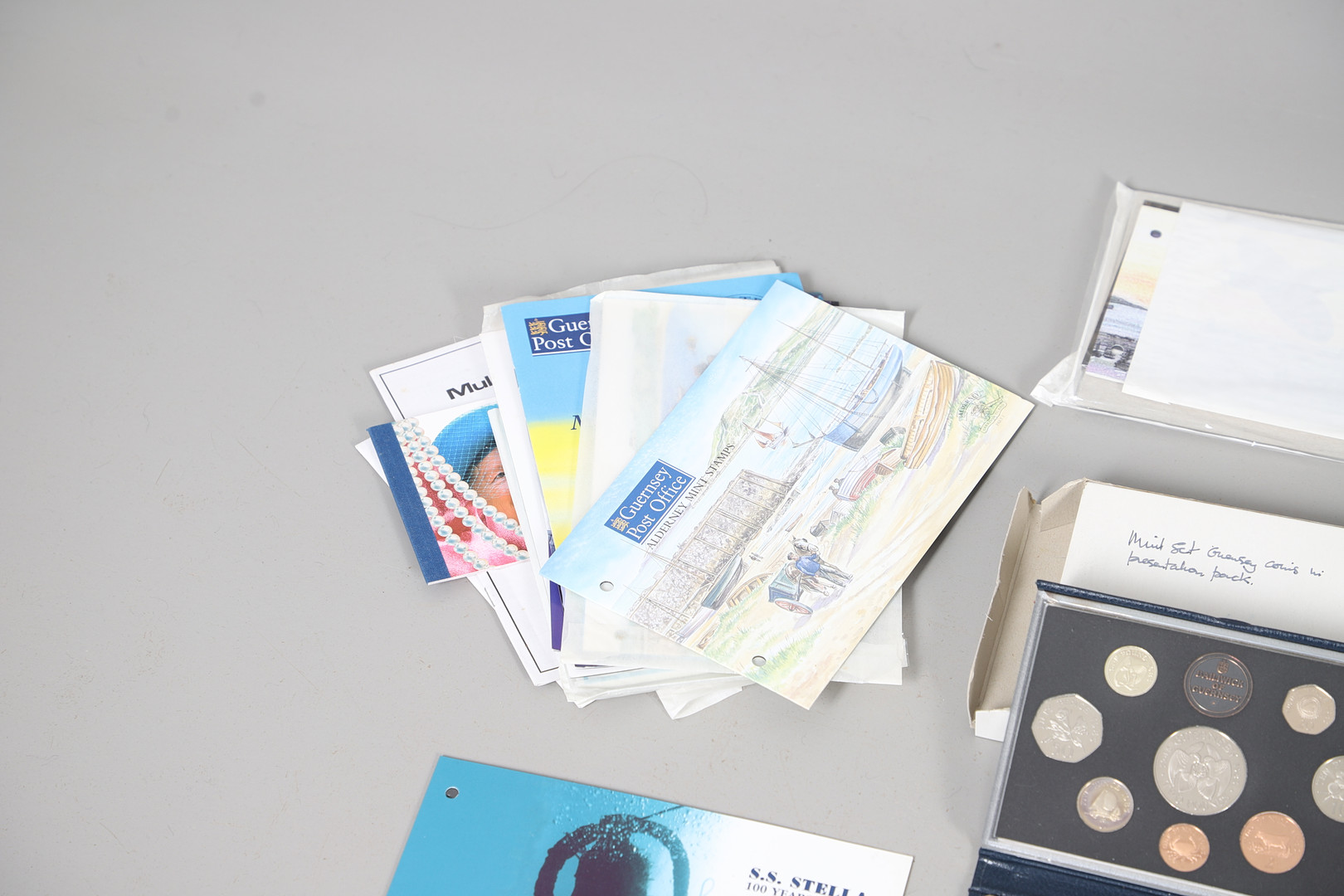 MINT STAMP PACKS - GUERNSEY & ALDERNEY, & COIN SETS.