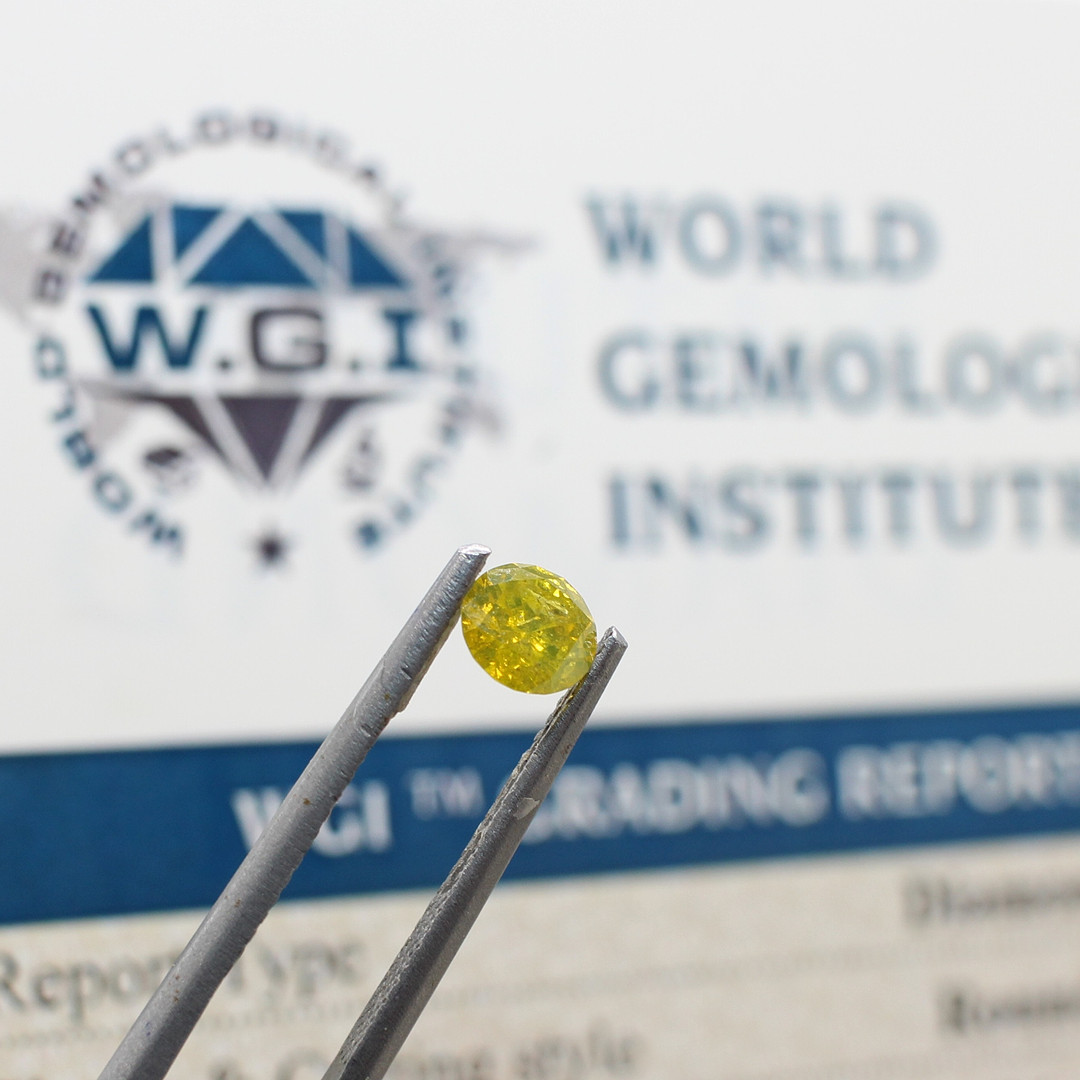 LOOSE FANCY YELLOW DIAMOND 0.53CT.