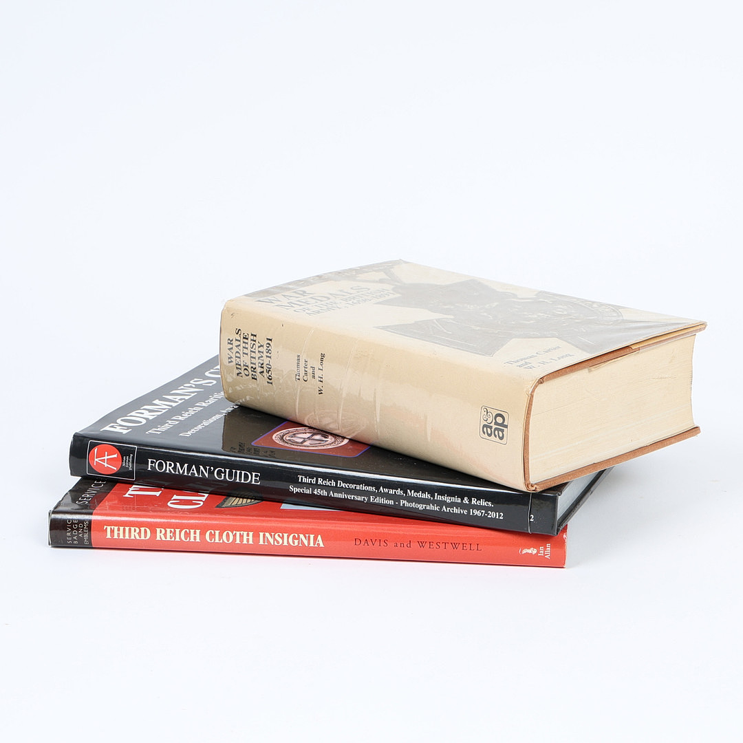 THREE MILITARIA RELATED REFERENCE BOOKS AND TWO WW1 FRAMED PHOTOGRAPHS (5).