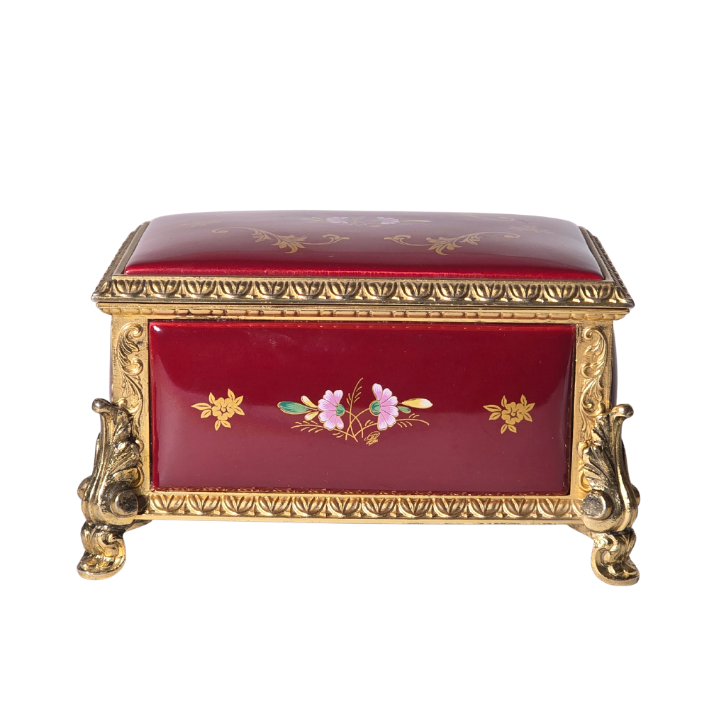 Caja joyero musical en porcelana y bronce.