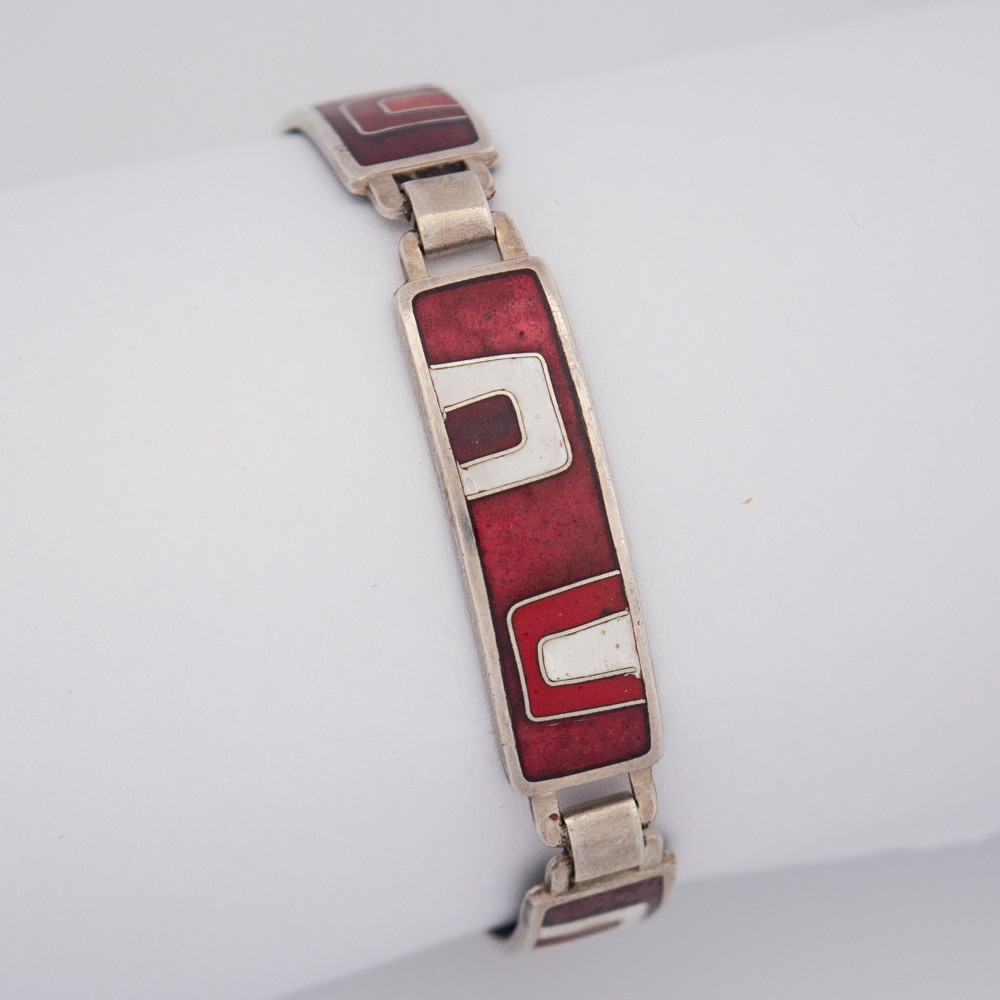GLIEDERARMBAND DER DEUTSCHEN SCHMUCKMANUFAKTUR PERLI AUS SCHWÄBISCH GMÜND, 925ER SILBER MIT ROTEN SOWIE WEISSEN EMAILLE-ELEMENTEN, 1970ER JAHRE.
