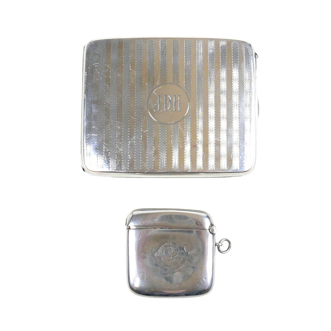 A GEORGE V SILVER CIGARETTE CASE AND VESTA CASE.