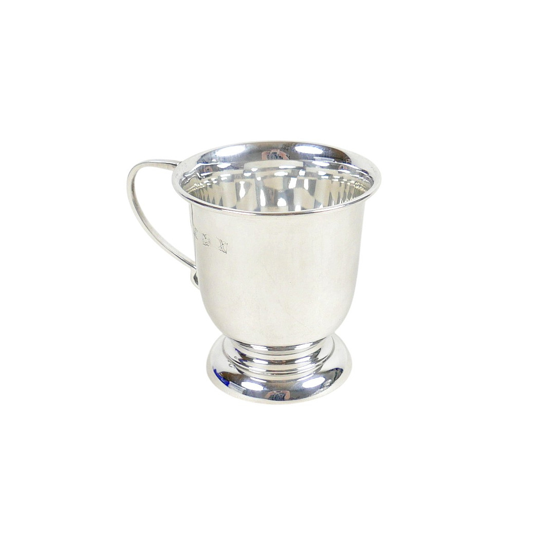 AN ELIZABETH II SILVER CHRISTENING MUG.