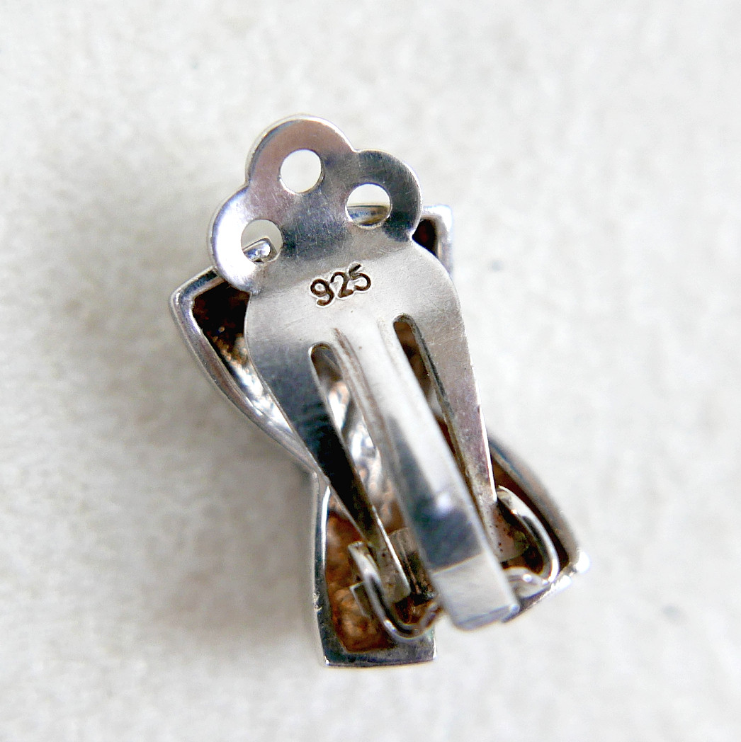 A GEORG JENSEN SILVER RING AND TWO PAIRS OF SILVER EARRINGS.