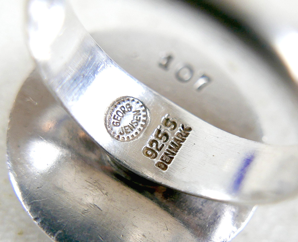 A GEORG JENSEN SILVER RING AND TWO PAIRS OF SILVER EARRINGS.