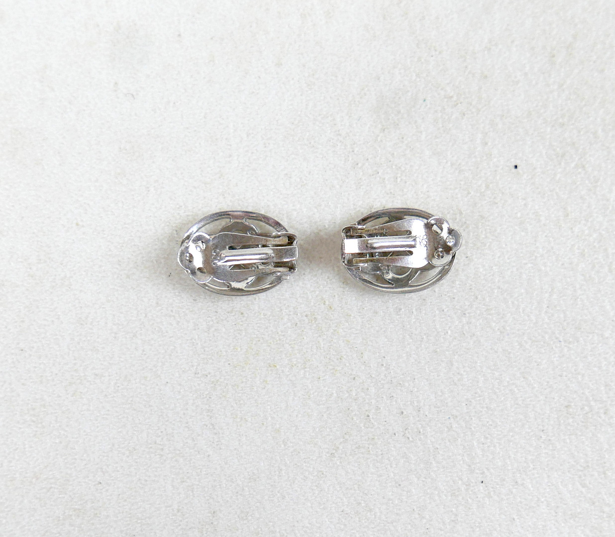 A GEORG JENSEN SILVER RING AND TWO PAIRS OF SILVER EARRINGS.