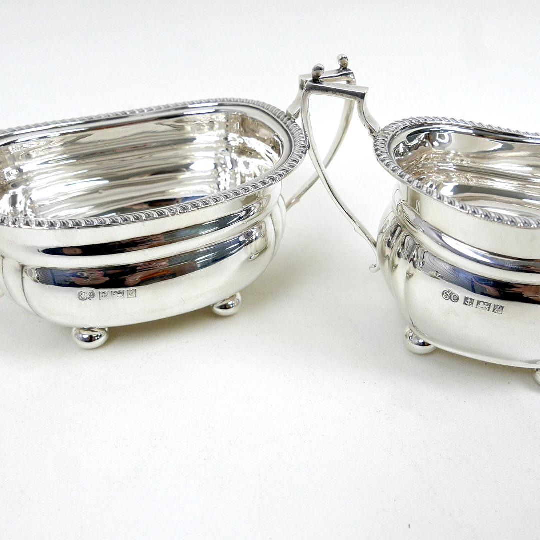 AN ELIZABETH II FOUR-PIECE SILVER TEA SET.