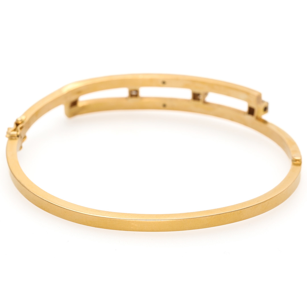 ARMRING, 18 k tvåfärgat guld med åttkantslipade diamanter, Svedboms.
