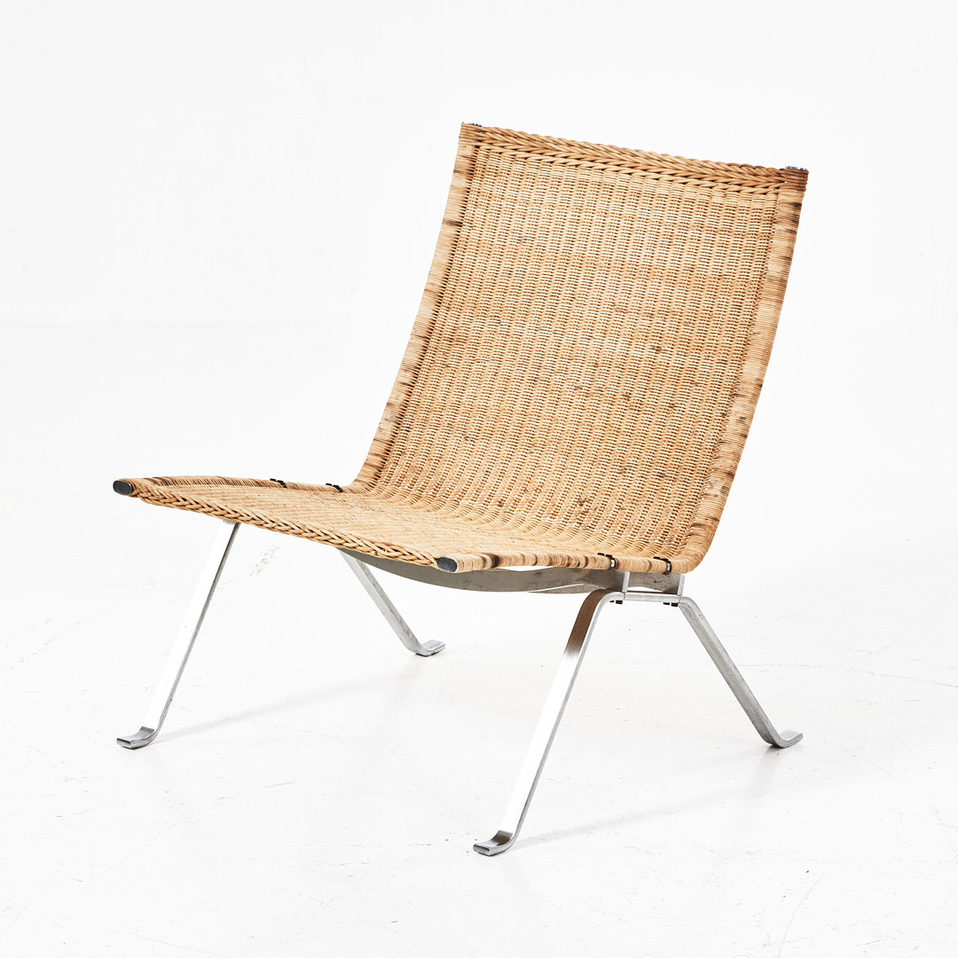 POUL KJAERHOLM. Fåtölj, PK-22, stomme av rostfritt stål, sits av flätad rotting.