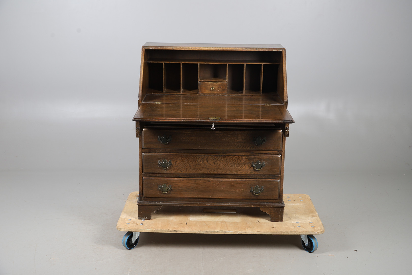 AN OAK FINISH BUREAU.