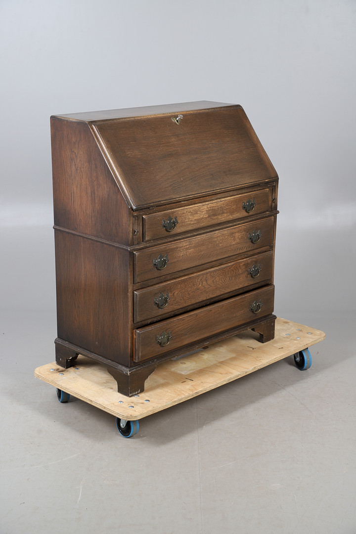 AN OAK FINISH BUREAU.