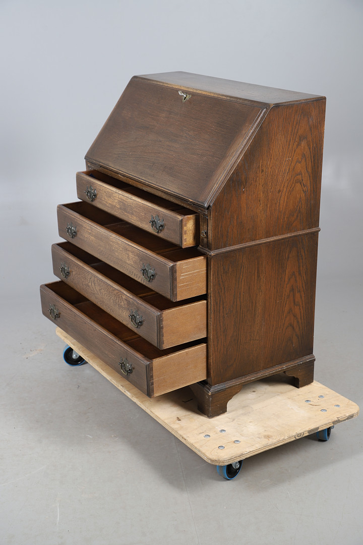 AN OAK FINISH BUREAU.