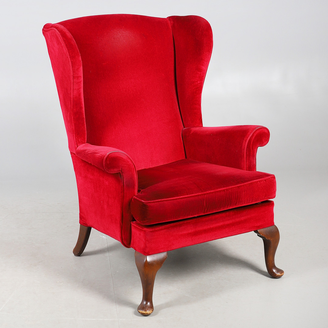 A PARKER KNOLL WING BACK CHAIR.