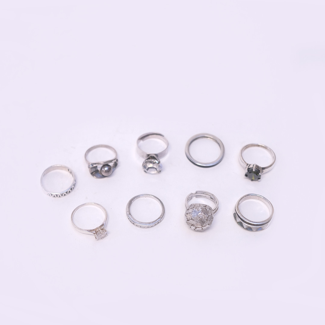 RINGAR, SILVER, NIO STYCKEN.