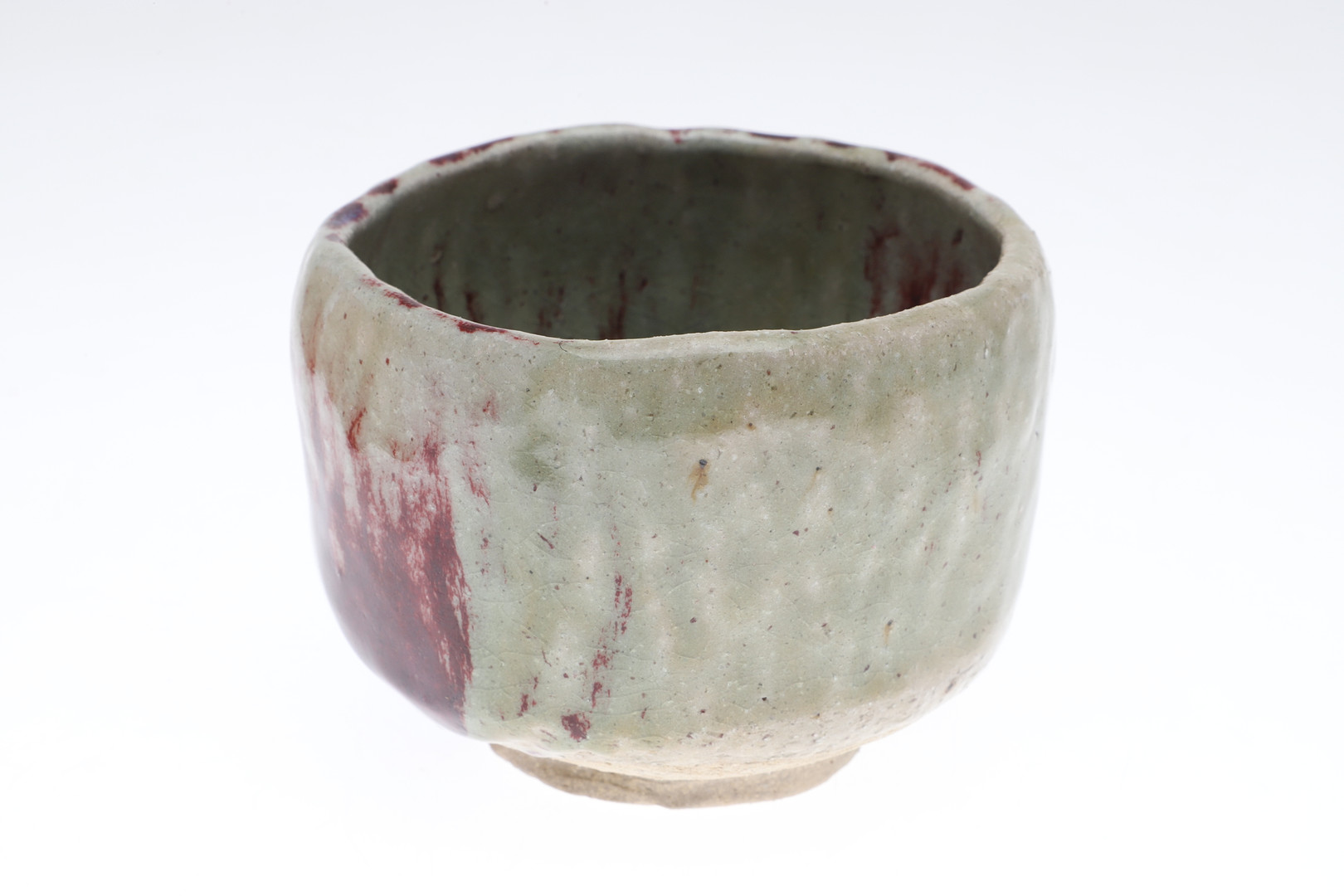 A 20TH CENTURY ORIENTAL BOXED GLAZED POTTERY FOOTED BOWL.
