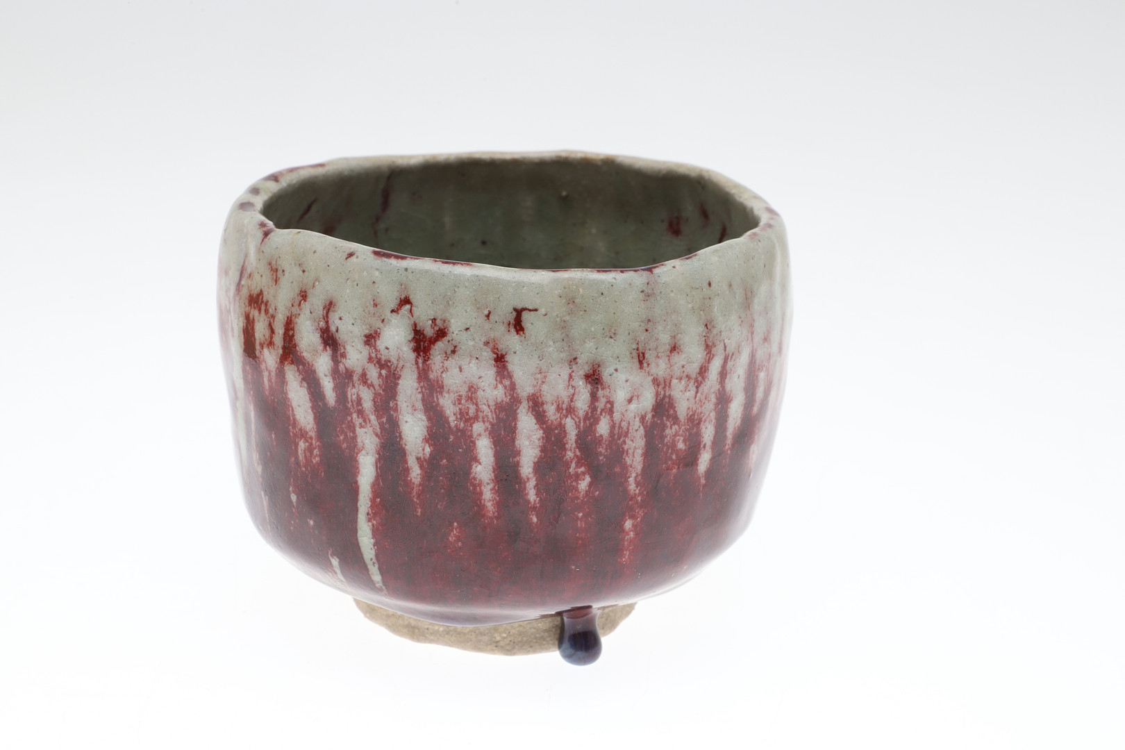 A 20TH CENTURY ORIENTAL BOXED GLAZED POTTERY FOOTED BOWL.
