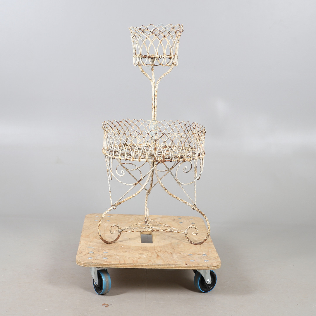 AN ANTIQUE PAINTED WIRE-WORK TWO TIER POT STAND.