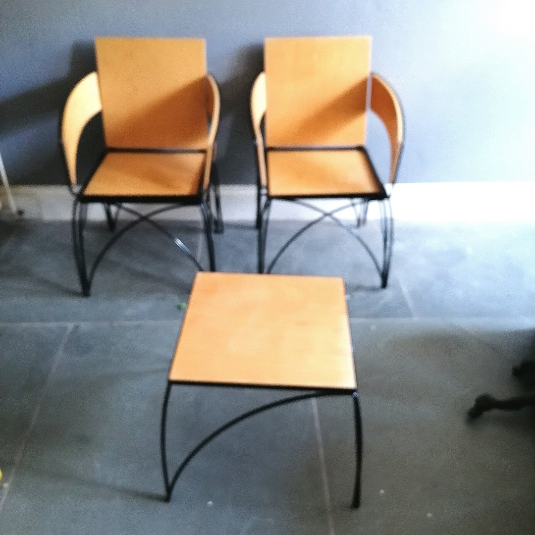 MID CENTURY METAMORPHIC BLACK METAL AND PLYWOOD CHAIRS.