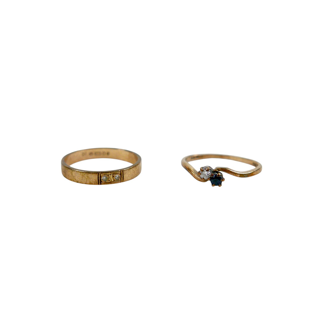 TWO 9CT GOLD RINGS.
