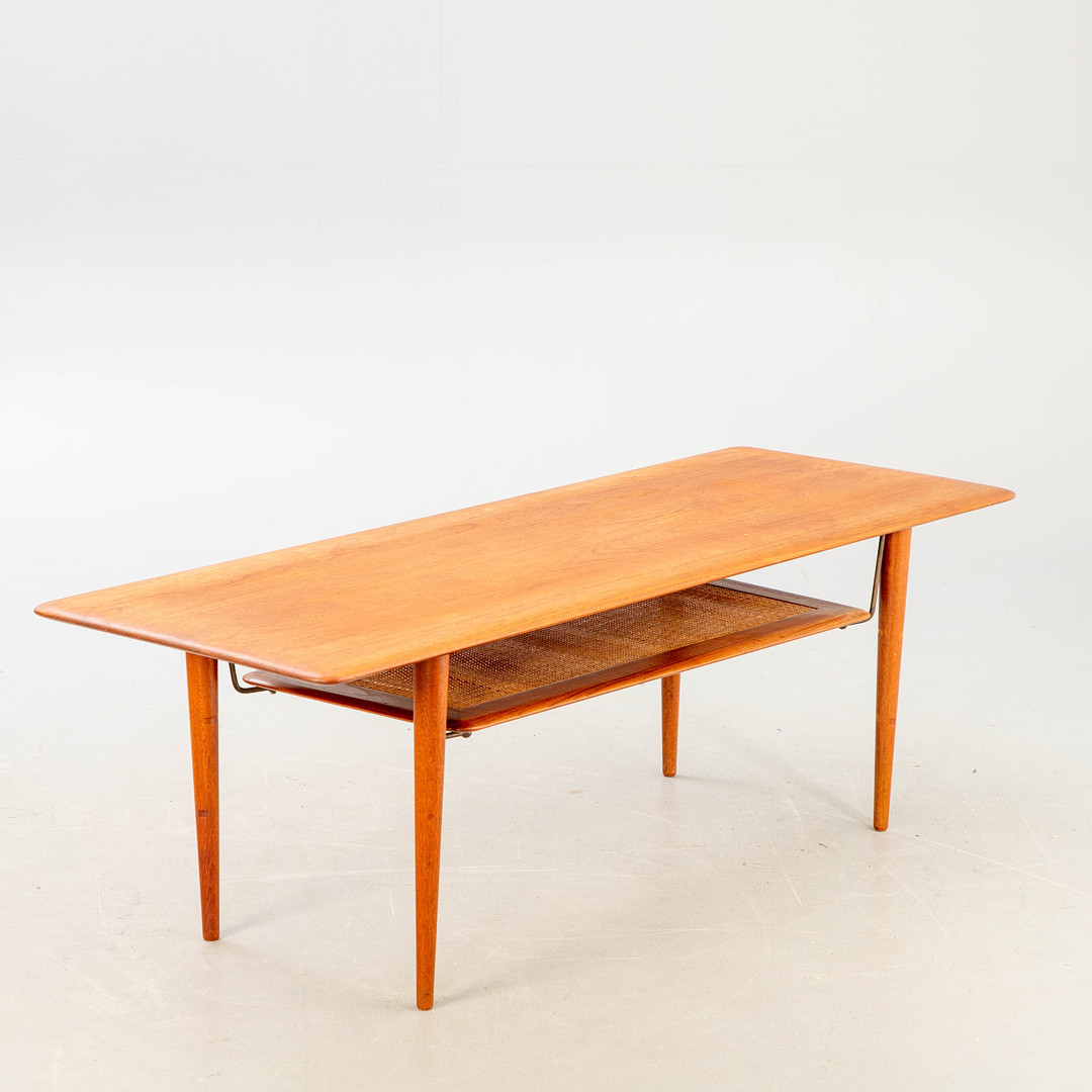 PETER HVIDT UND ORLA MOLGAARD-NIELSEN. France & Son, Couchtisch, Modell 'FD 516', Teak, Rattan, Messing, Dänemark, 1956.