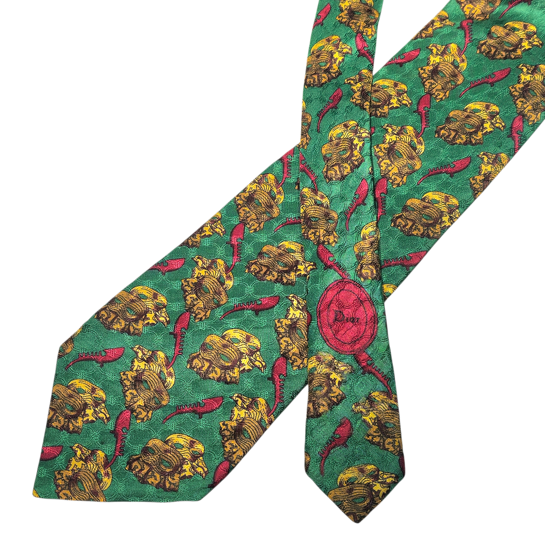 Christian Dior. Corbata en seda natural color verde con detalle de máscaras.