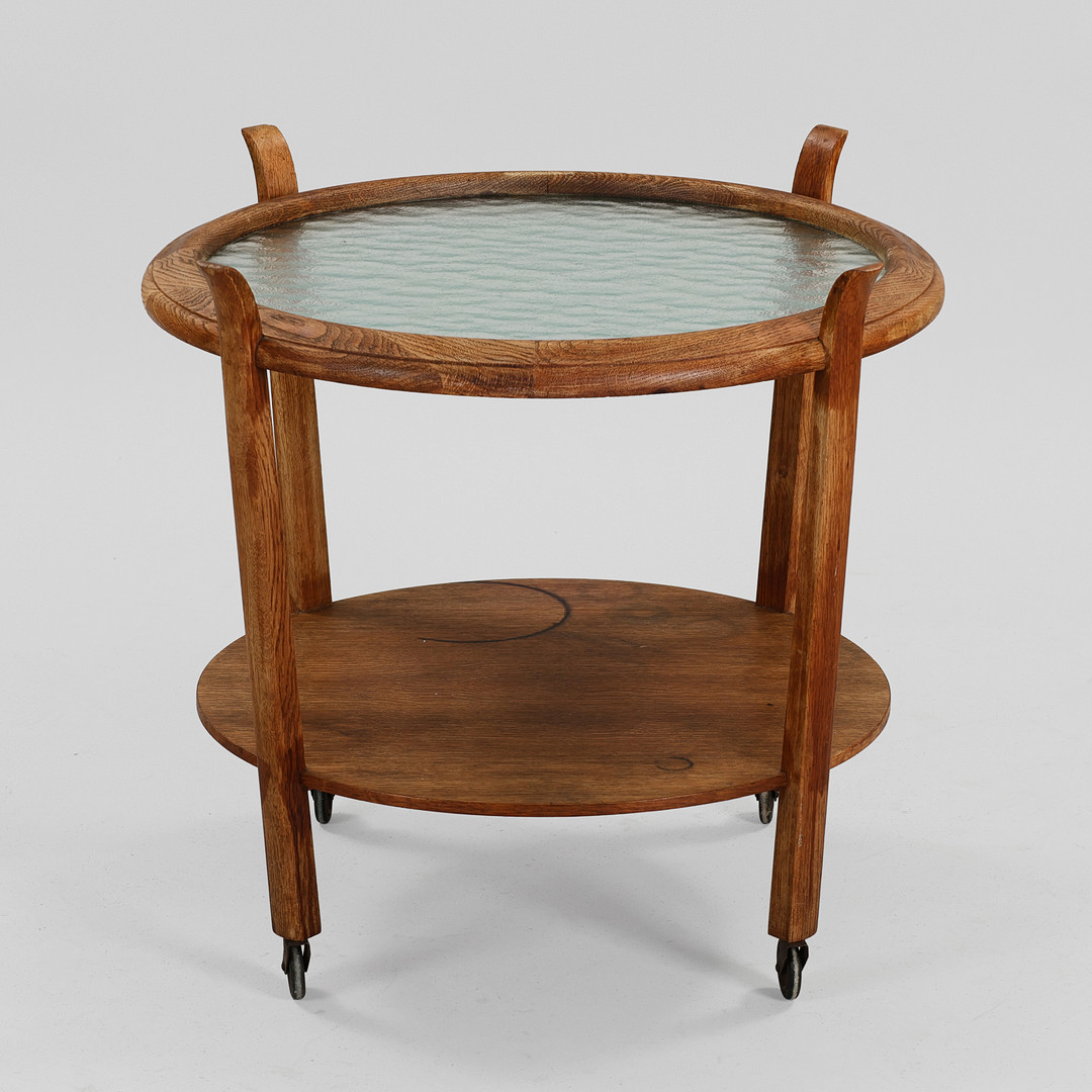 ANDREAS TUCK. Cirkulært rullebord/sofabord med stel af egetræ, topplade af hærdet glas, Danmark, ca. 1940'erne.