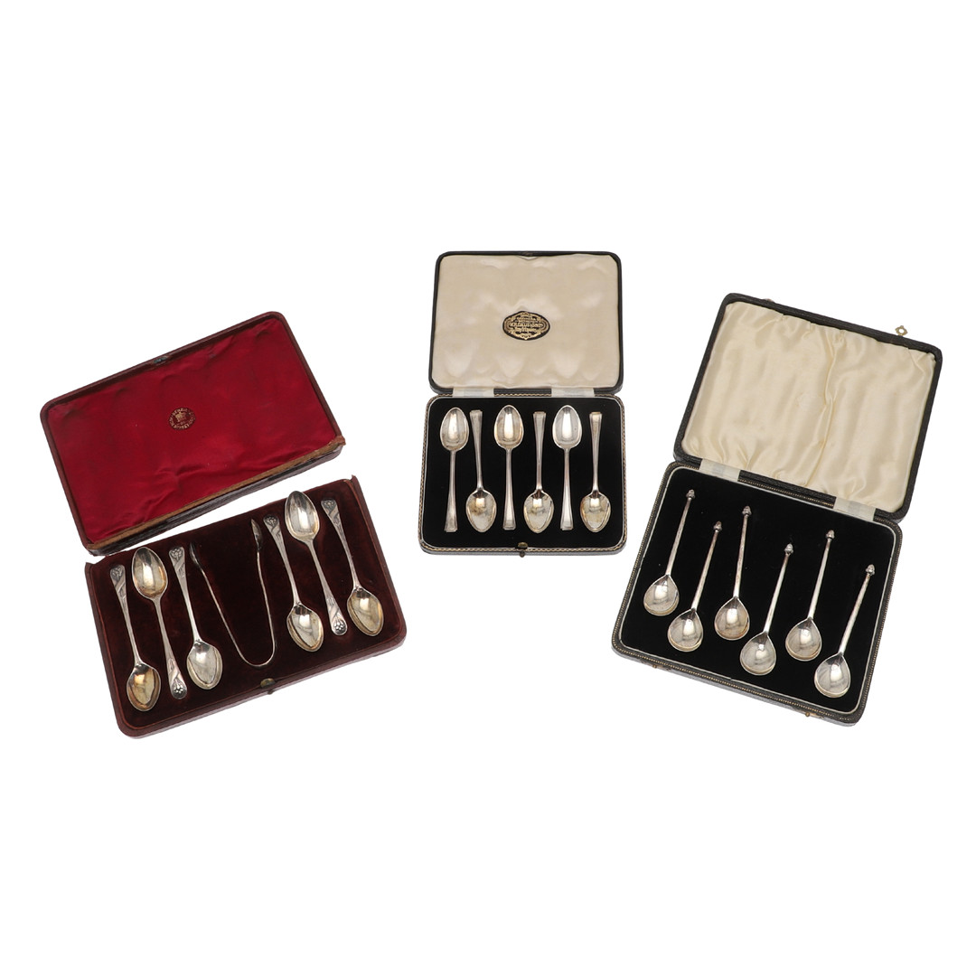 THREE CASED SETS OF 20TH CENTURY SILVER TEASPOONS.
