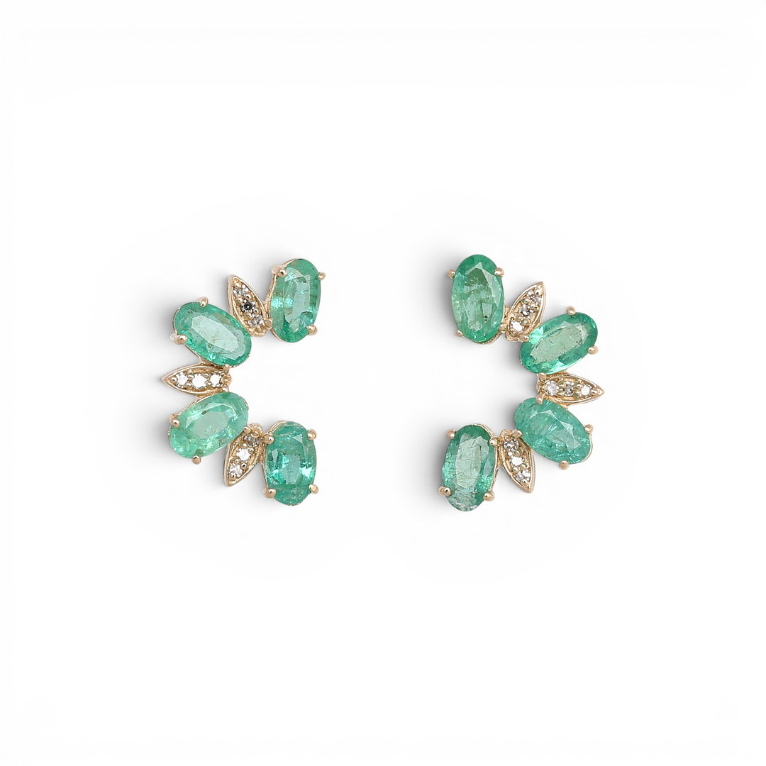 Emeralds and diamonds earrings.