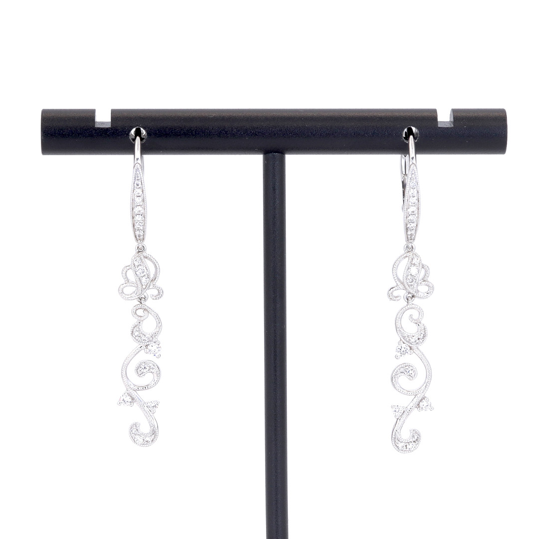 18CT GOLD DIAMOND EARRINGS.