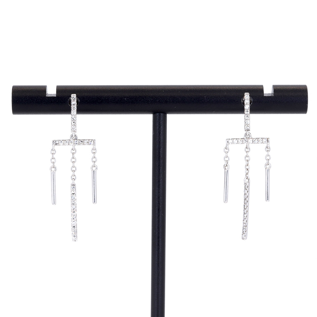 18CT GOLD DIAMOND EARRINGS.