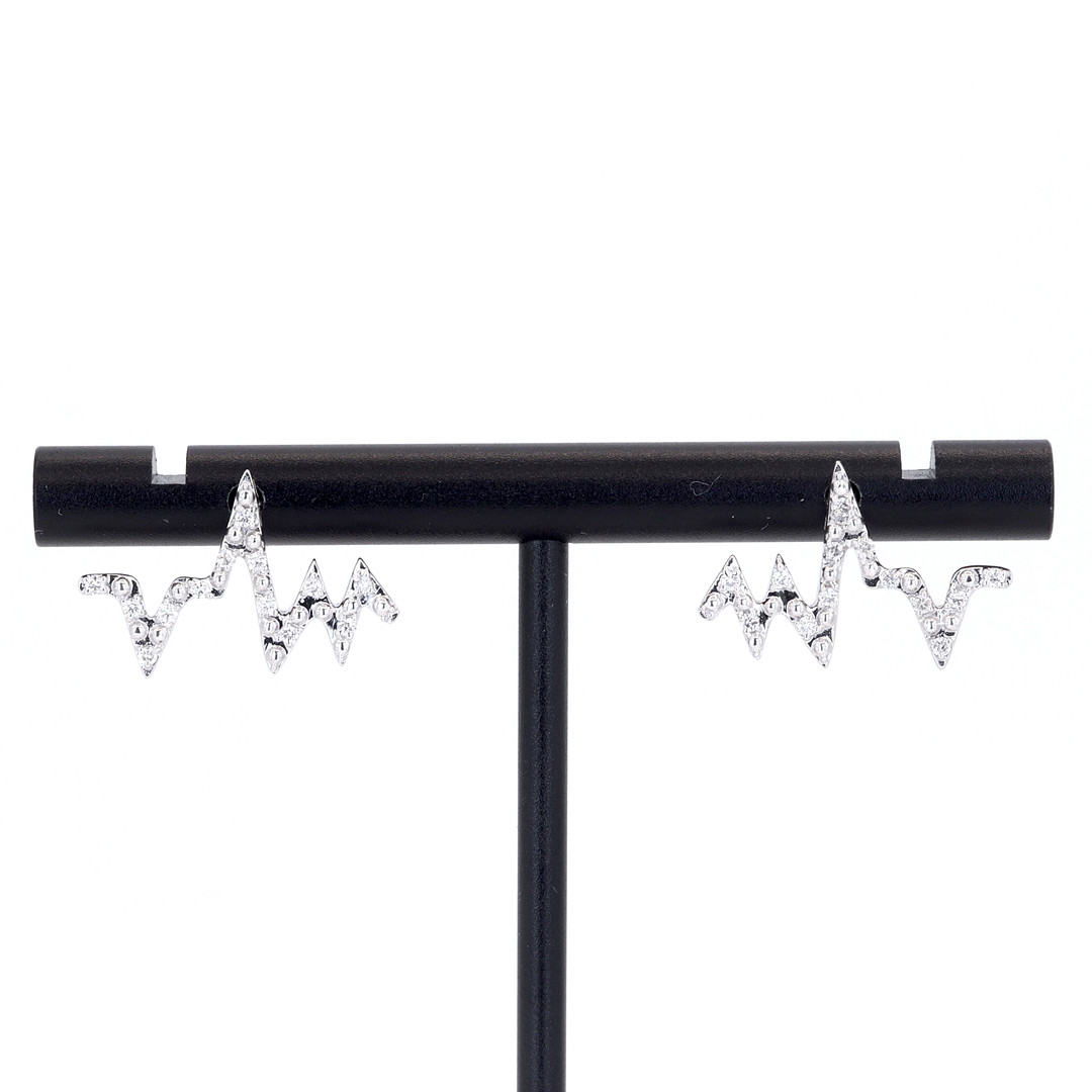 14CT GOLD DIAMOND EARRINGS.