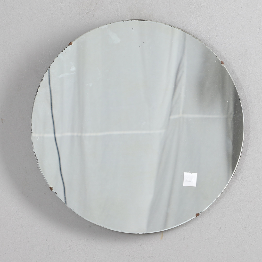 A 1930s CIRCULAR WALL MIRROR.