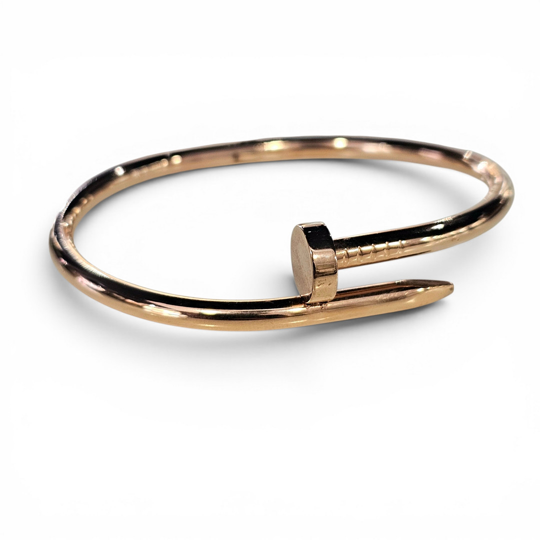Pulsera estilo clavo en acero al oro rosa.