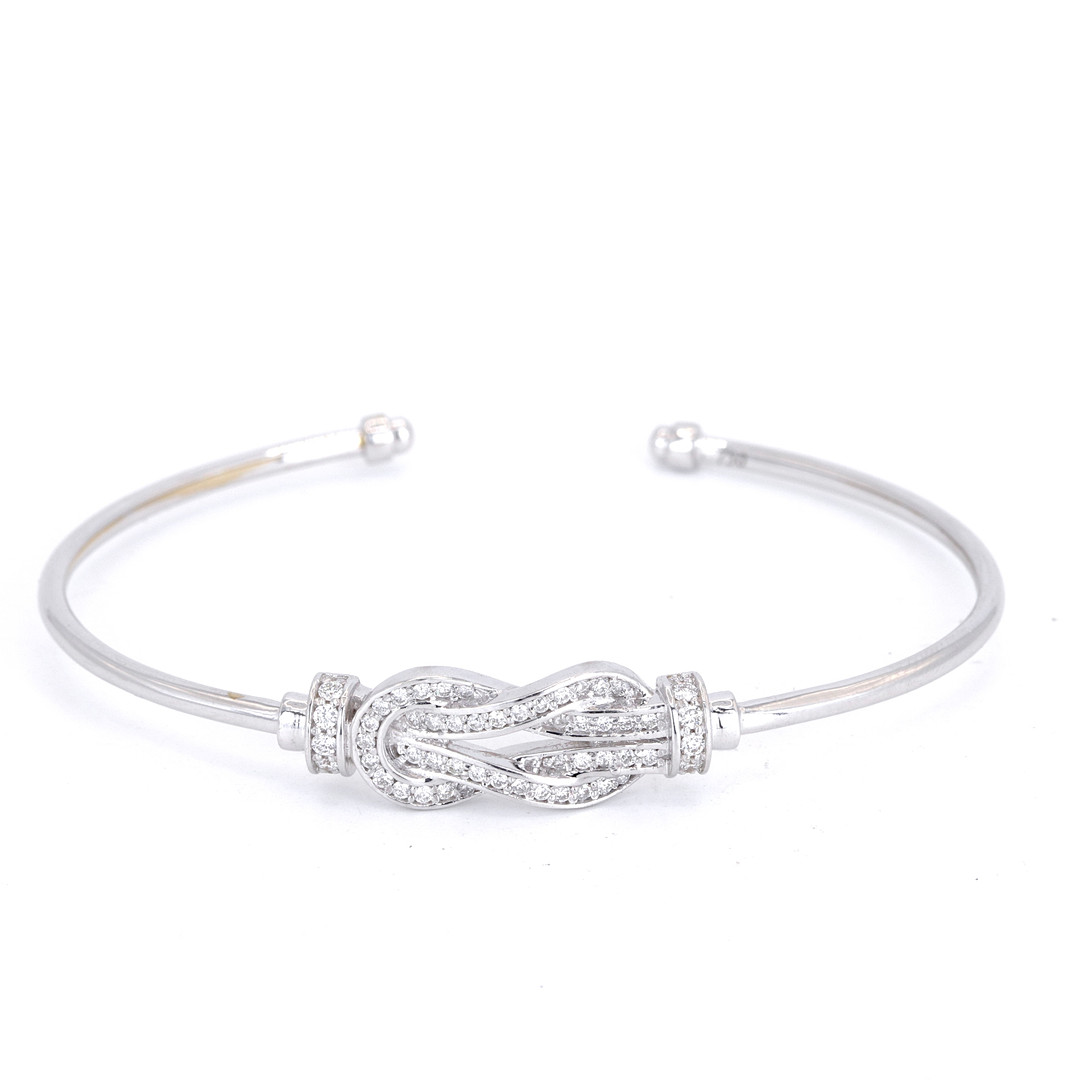 18CT GOLD DIAMOND SET BANGLE.