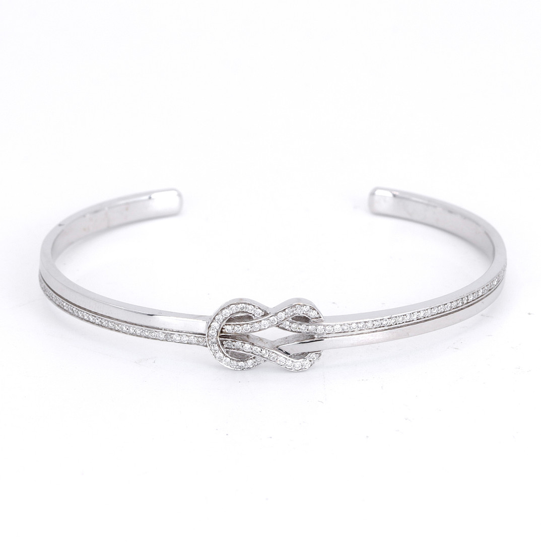 18CT WHITE GOLD DIAMOND BANGLE.