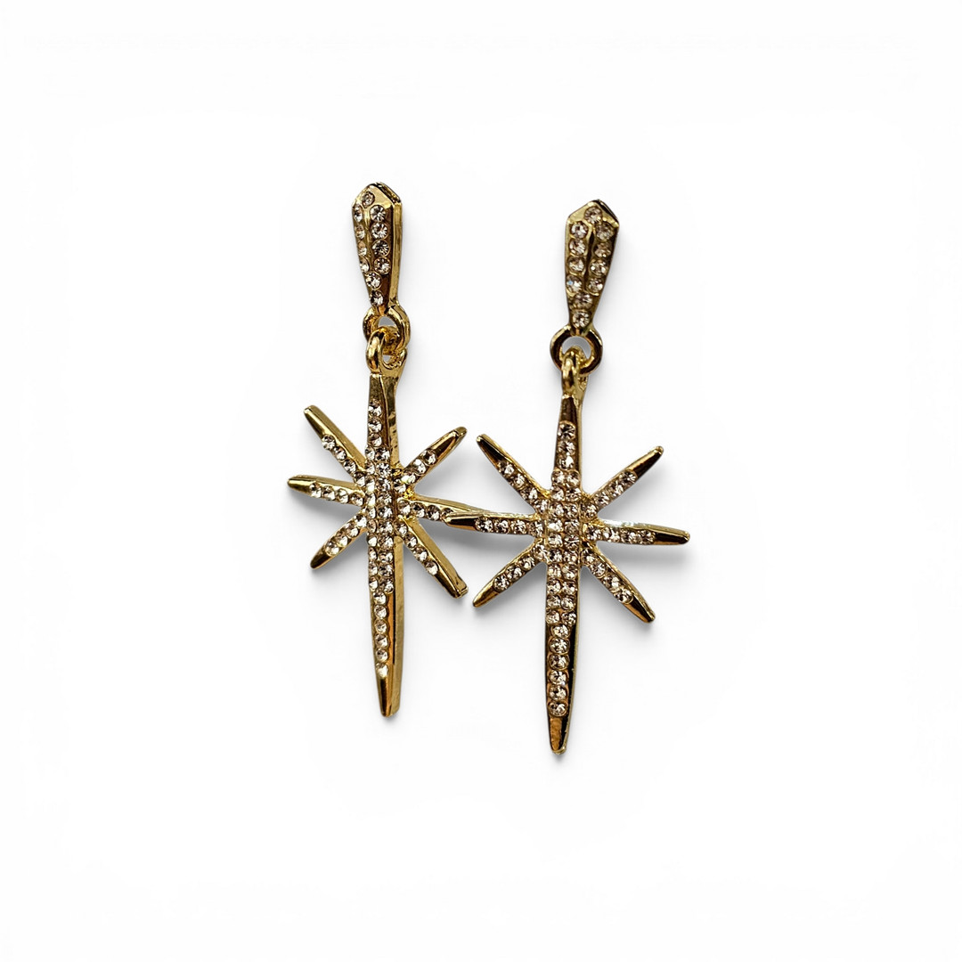 Pendientes con forma de estrella en metal dorado con cristales.