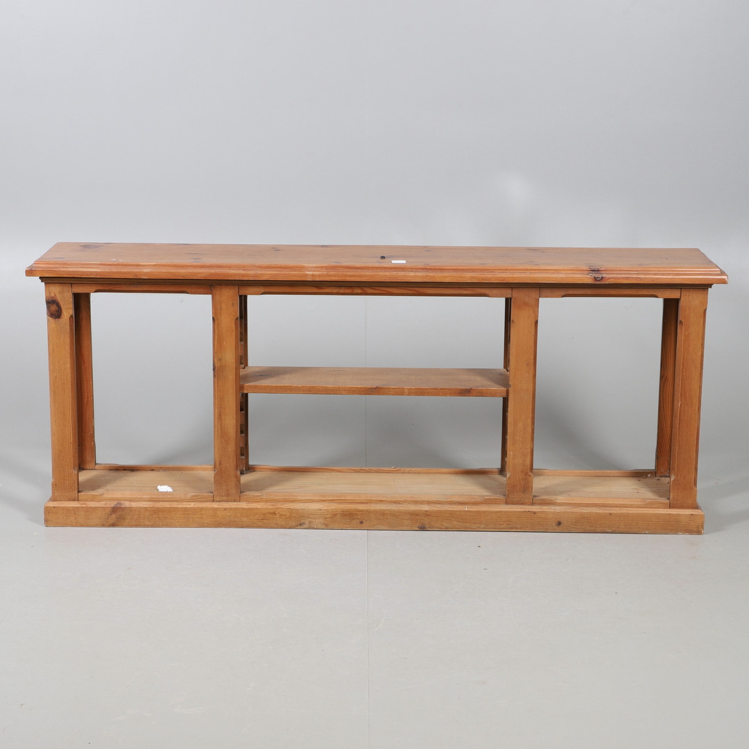 A NARROW PINE LOW OPEN BOOKSHELF/STAND.