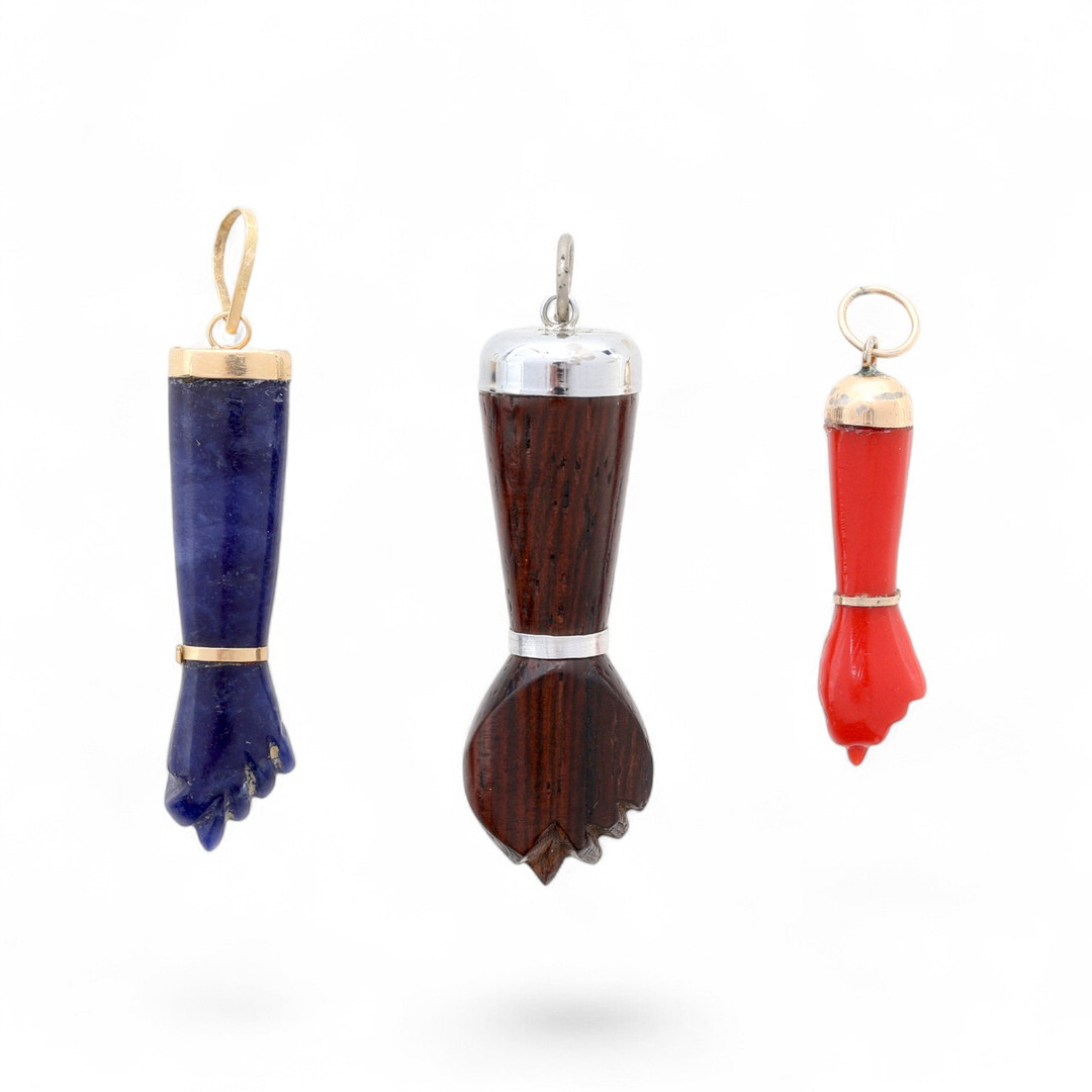 Three figa amulet pendants, first half of the 20th Century.