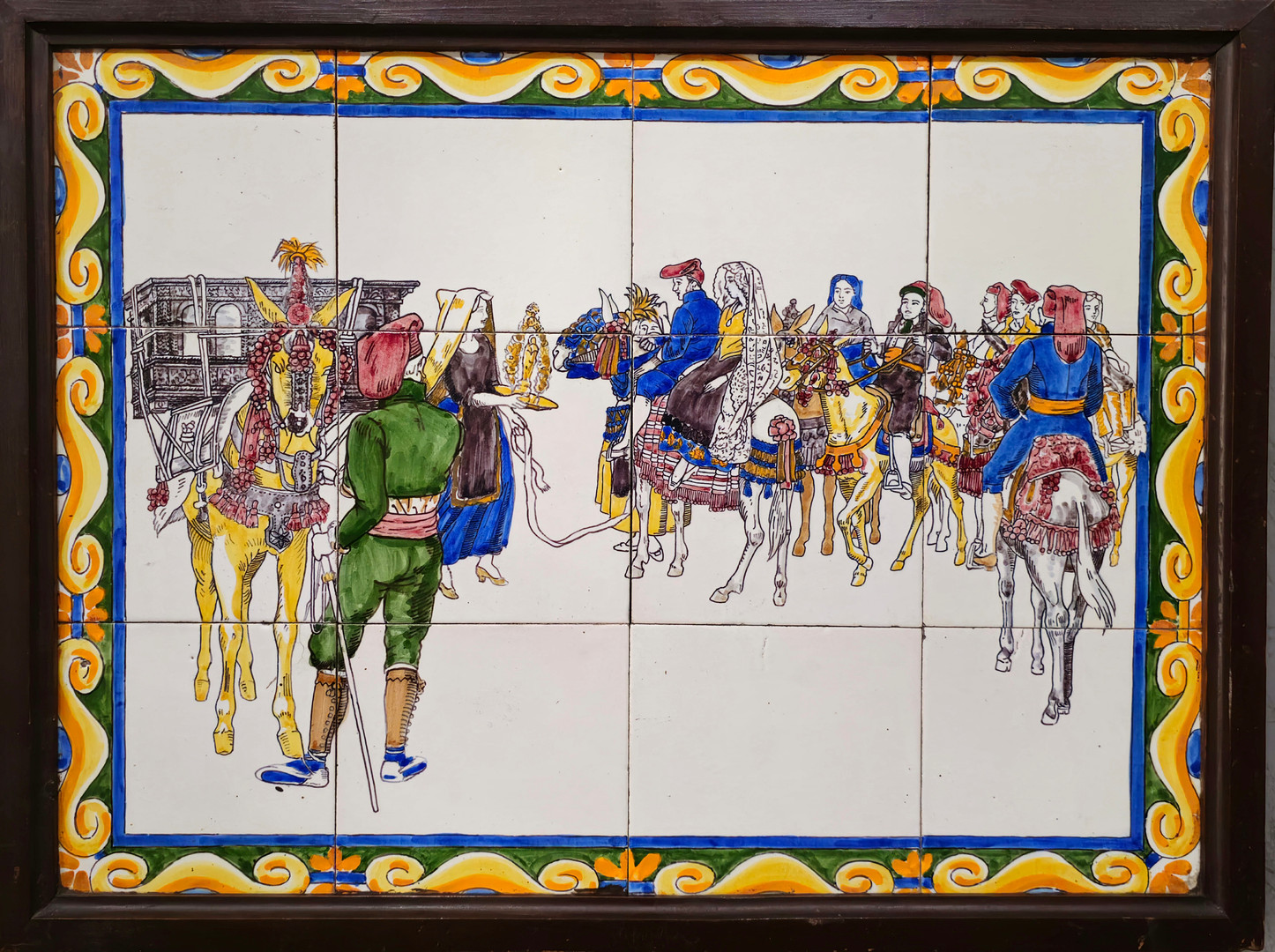 Azulejos enmarcados representando una boda.