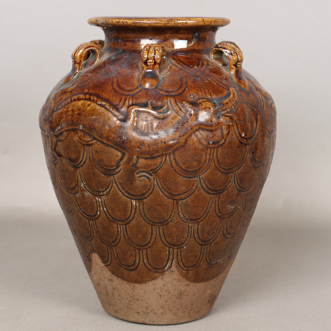 A CHINESE STONEWARE STORAGE JAR.