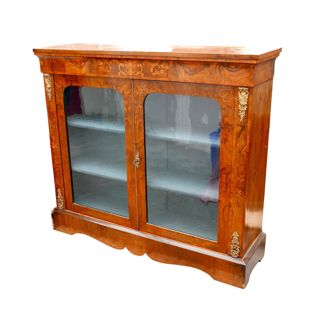 A VICTORIAN INLAID WALNUT BOOKCASE.