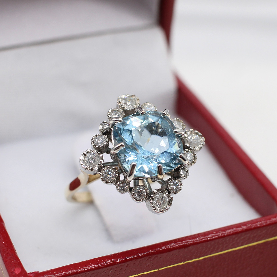 DIAMOND & BLUE TOPAZ RING.