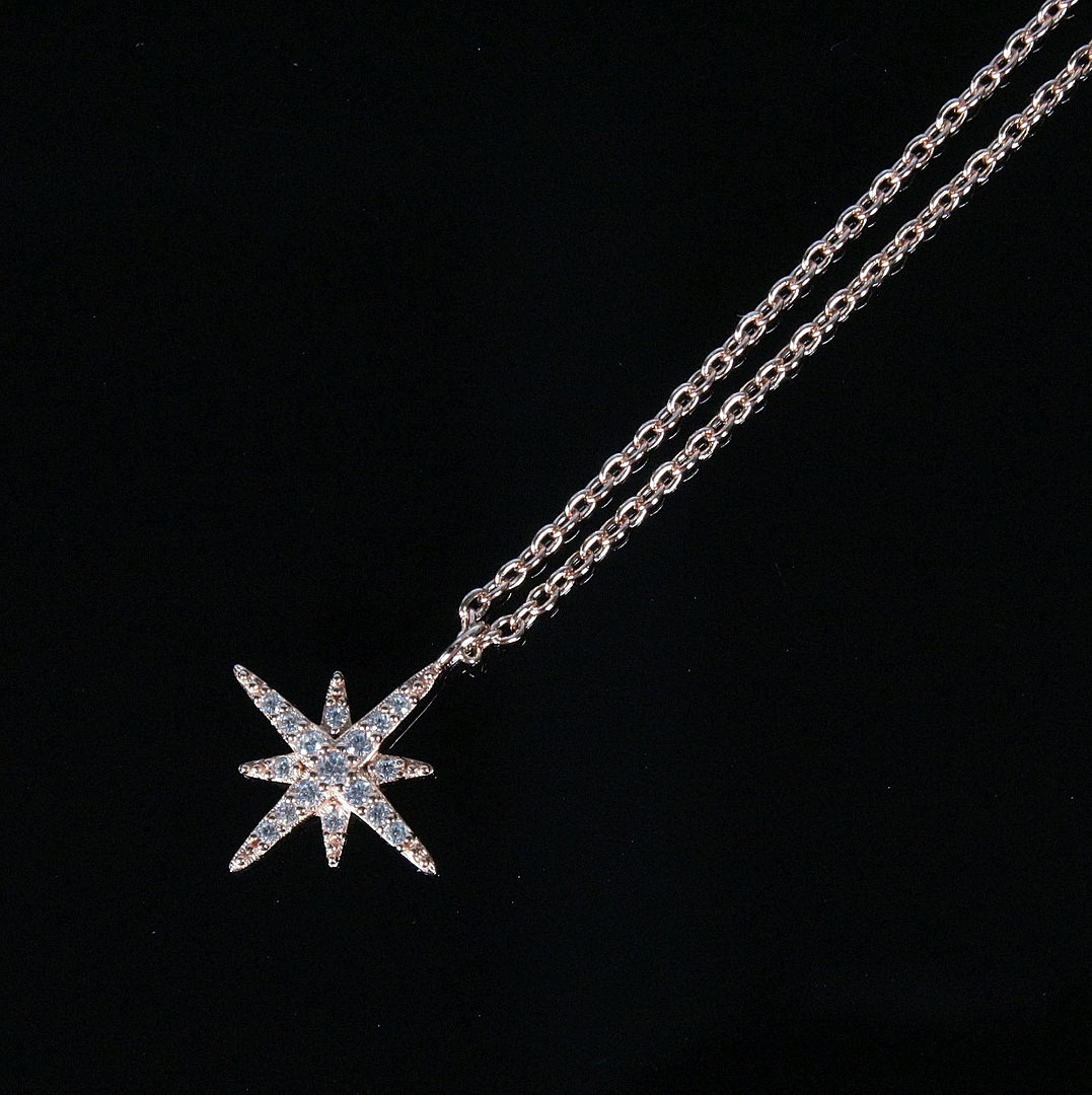 MERALIN JEWELRY. Halskette mit Sternanhänger, besetzt mit Zirkonia, 925er Sterlingsilber, rosévergoldet, Italien.