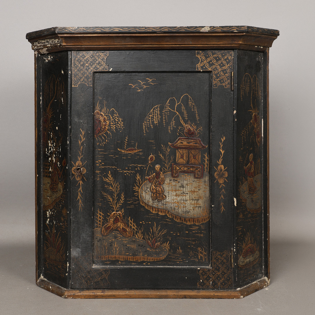 A LATE 19TH CENTURY BLACK CHINOISERIE LACQUERED HANGING CORNER CUPBOARD.