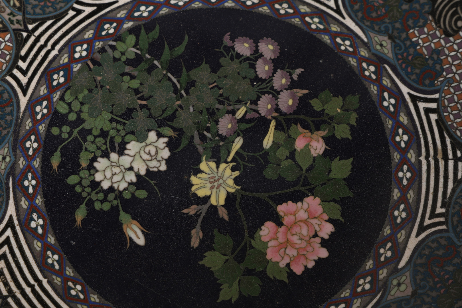 A JAPANESE CLOISONNE ENAMEL PLATE, MEIJI PERIOD.