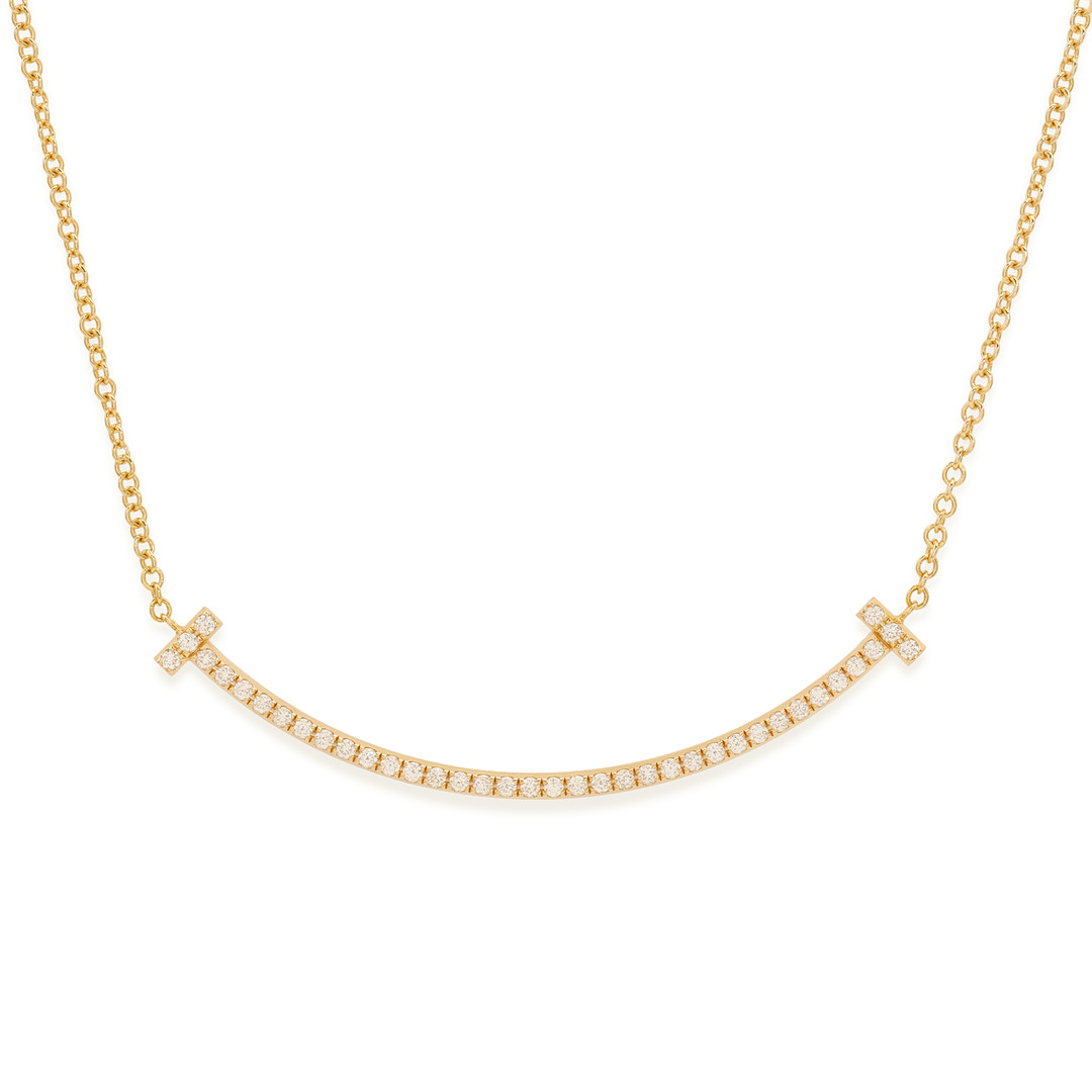 TIFFANY & CO. Tiffany T collection, 'T Smile small ' halskæde af 18 kt guld med diamanter. 0,10 ct.
