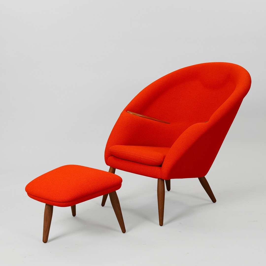 ARNOLD MADSEN (1907-1989). 'Oda' armchair with ottoman made of solid walnut wood and red Hallingdal 65 textile from Kvadrat, Audo Copenhagen, Denmark, designed in 1956, (2).